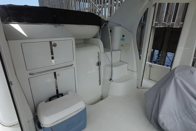 Slide: The Image of 2004 Carver 396 Aft Cabin MY interior with storage cabinets and steps. - 14