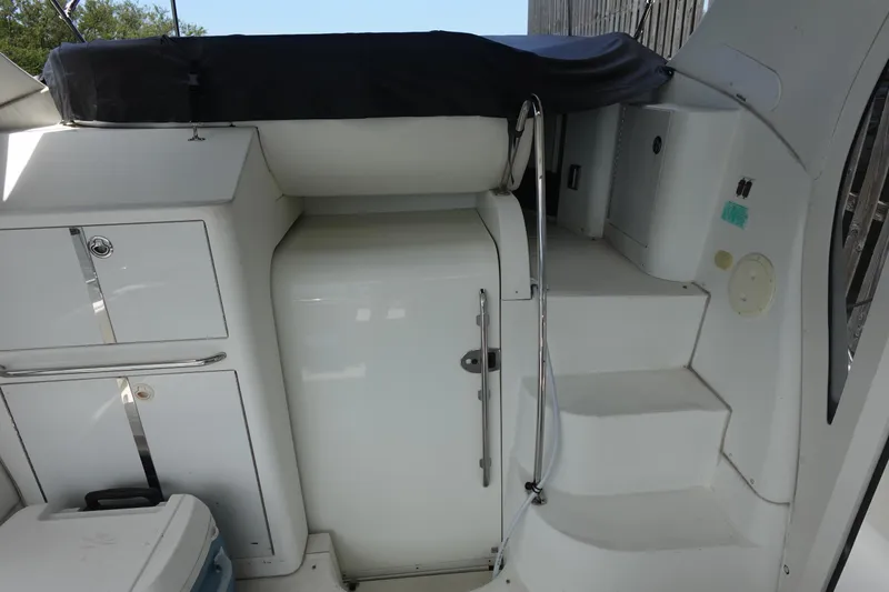 Slide: The Image of 2004 Carver 396 Aft Cabin MY interior with stairs and storage compartments. - 15