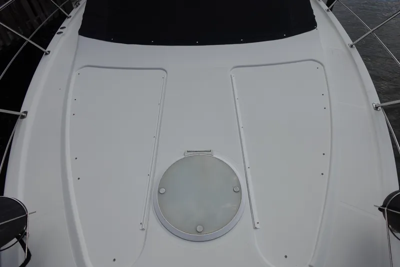 Slide: The Image of 2004 Carver 396 Aft Cabin MY boat deck with hatch and railing. - 24