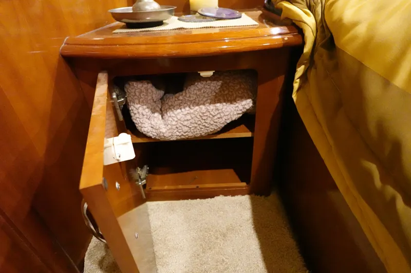 Slide: The Image of Open cabinet in 2004 Carver 396 Aft Cabin MY with cozy interior. - 30