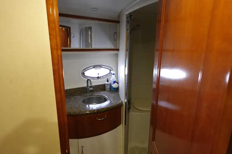 Slide: The Image of 2004 Carver 396 Aft Cabin MY bathroom with sink, mirror, and shower. - 33