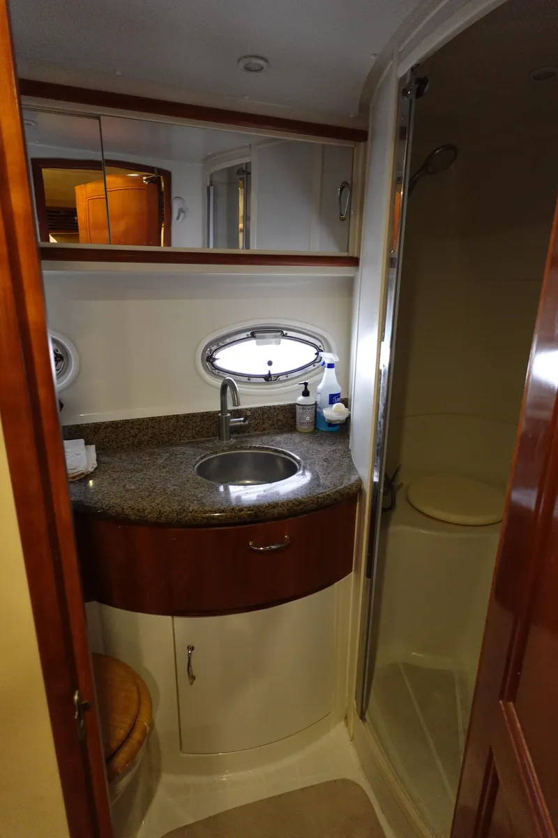 Slide: The Image of 2004 Carver 396 Aft Cabin MY bathroom with sink, mirror, and shower. - 39