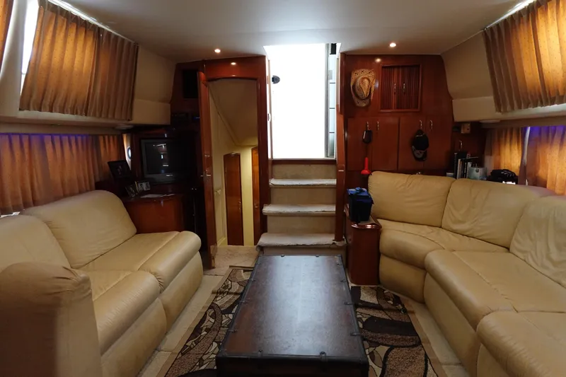 Slide: The Image of Luxurious interior of 2004 Carver 396 Aft Cabin MY yacht with beige leather seating. - 7