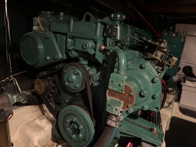 Slide: The Image of Green Nova 48 engine from 1990, showcasing mechanical components and belts. - 25