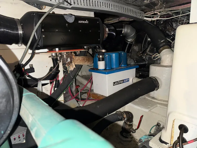 Slide: The Image of Engine room of a 1990 Nova 48 boat with Airtronic heater and Lectra San system. - 28