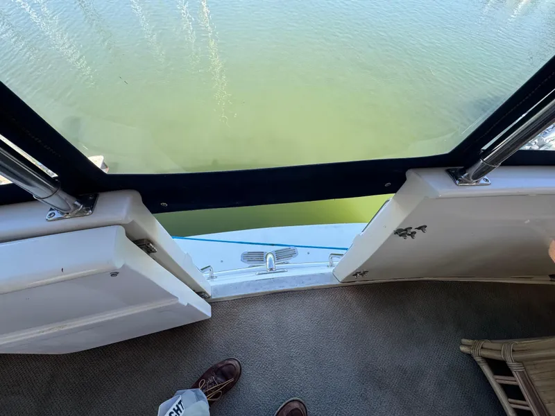 Slide: The Image of View from a Nova 48 yacht, 1990 model, overlooking calm green water. - 9