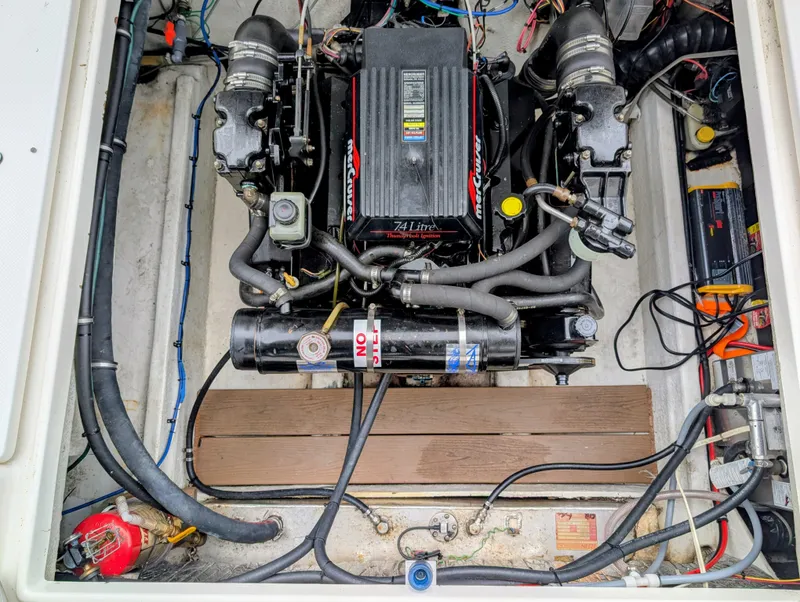 Slide: The Image of Engine compartment of a 1997 Bayliner 2859 Ciera Express boat, featuring a MerCruiser engine. - 11