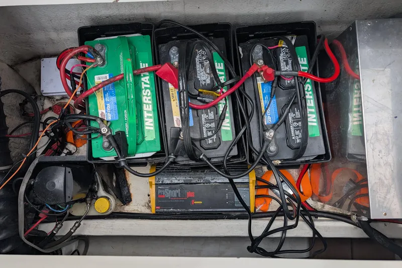 Slide: The Image of Battery compartment of a 1997 Bayliner 2859 Ciera Express with Interstate batteries and wiring. - 13