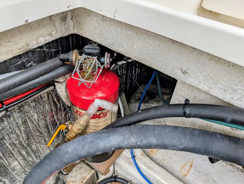 Slide: The Image of Engine compartment of a 1997 Bayliner 2859 Ciera Express with fire extinguisher and hoses. - 15