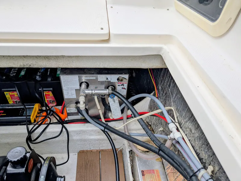 Slide: The Image of 1997 Bayliner 2859 Ciera Express engine compartment with wiring and battery setup. - 16