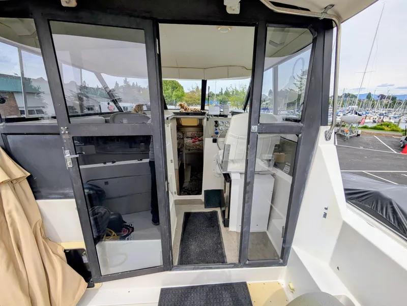 Slide: The Image of 1997 Bayliner 2859 Ciera Express interior view with helm and seating area. - 18