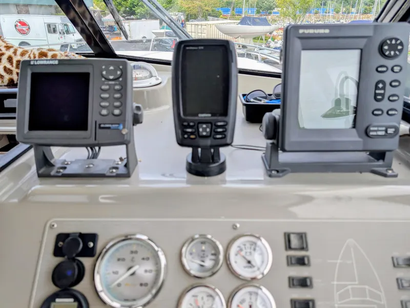 Slide: The Image of Control panel of a 1997 Bayliner 2859 Ciera Express with navigation instruments. - 23