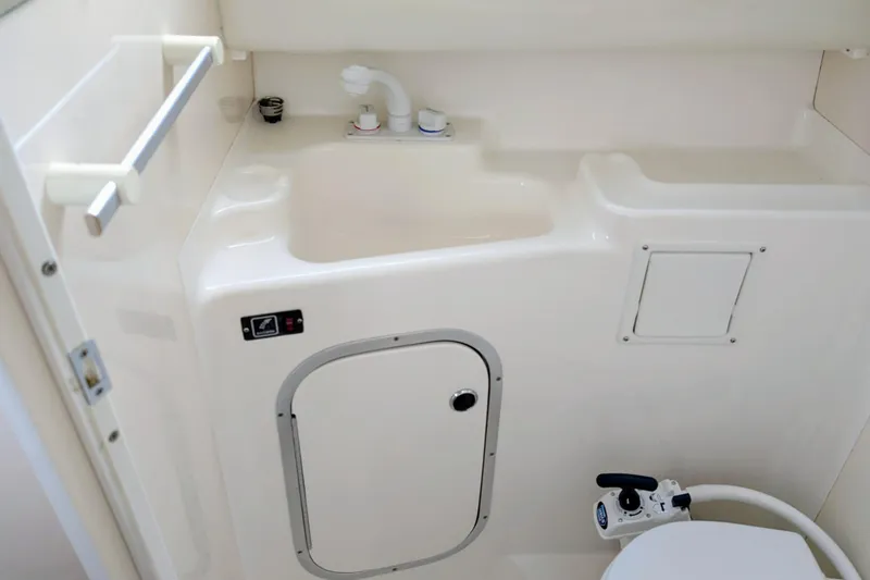 Slide: The Image of 1997 Bayliner 2859 Ciera Express bathroom with sink, faucet, and toilet. - 24