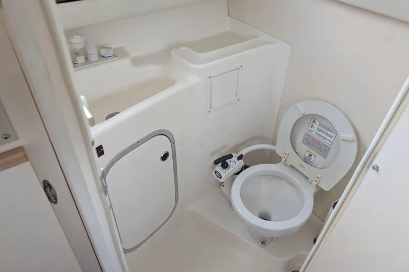 Slide: The Image of 1997 Bayliner 2859 Ciera Express boat bathroom with toilet and sink. - 26