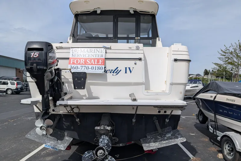 Slide: The Image of 1997 Bayliner 2859 Ciera Express boat for sale, rear view with outboard motor. - 3