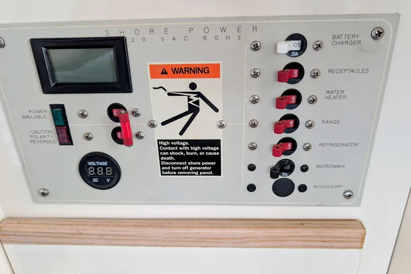 Slide: The Image of Electrical panel of a 1997 Bayliner 2859 Ciera Express with warning and voltage display. - 31
