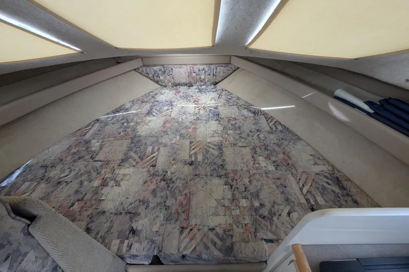 Slide: The Image of Interior cabin of 1997 Bayliner 2859 Ciera Express with patterned upholstery. - 38