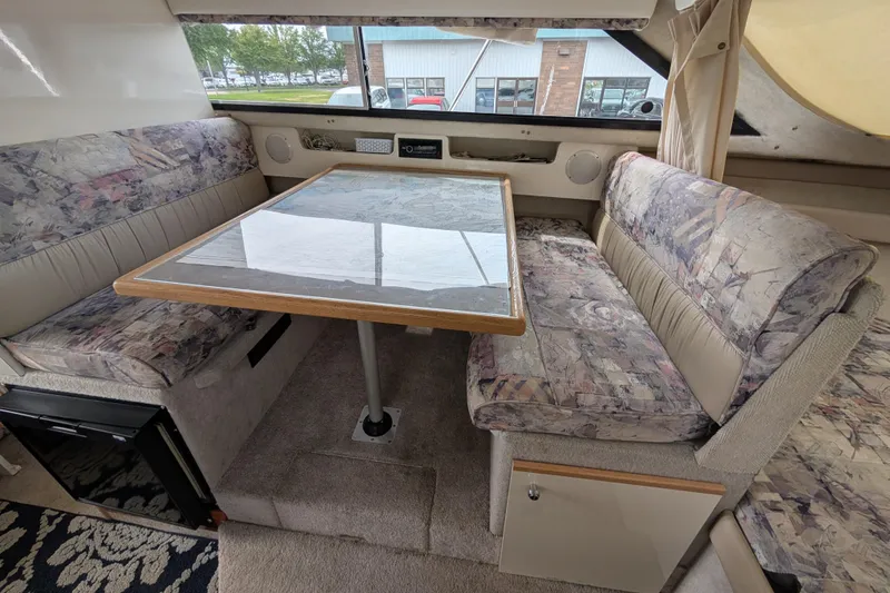 Slide: The Image of Interior of 1997 Bayliner 2859 Ciera Express with dining area and patterned seating. - 40