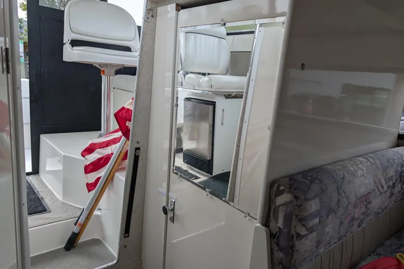 Slide: The Image of Interior of 1997 Bayliner 2859 Ciera Express with seating and American flag. - 44