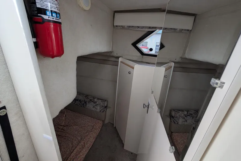 Slide: The Image of Interior cabin of 1997 Bayliner 2859 Ciera Express with fire extinguisher and storage. - 45
