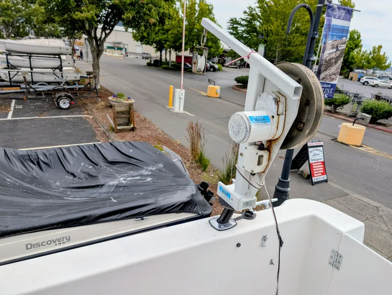 Slide: The Image of 1997 Bayliner 2859 Ciera Express with winch, parked near trees and street. - 5