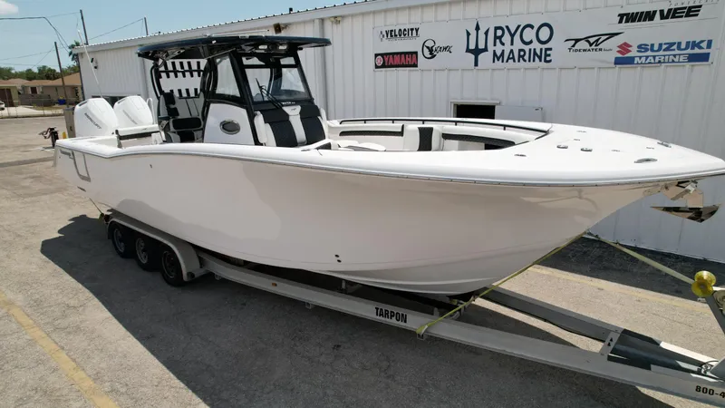 The Image of 2025 Tidewater 320 CC Adventure boat on trailer at Ryco Marine dealership. - 0