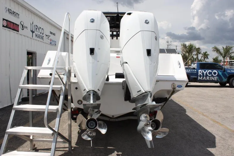 Slide: The Image of 2025 Tidewater 320 CC Adventure boat with dual outboard engines at Ryco Marine. - 10