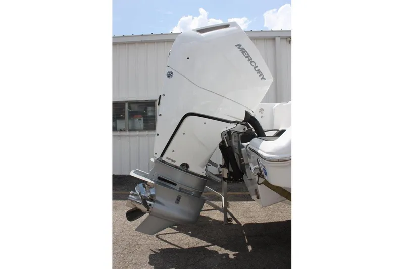 Slide: The Image of 2025 Tidewater 320 CC Adventure boat with Mercury outboard motor, side view. - 11