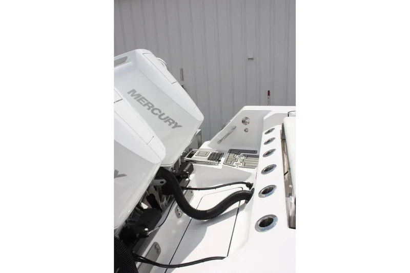 Slide: The Image of 2025 Tidewater 320 CC Adventure boat with Mercury engines, showcasing sleek design and functionality. - 15