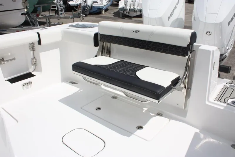 Slide: The Image of 2025 Tidewater 320 CC Adventure boat with sleek seating and modern design. - 19