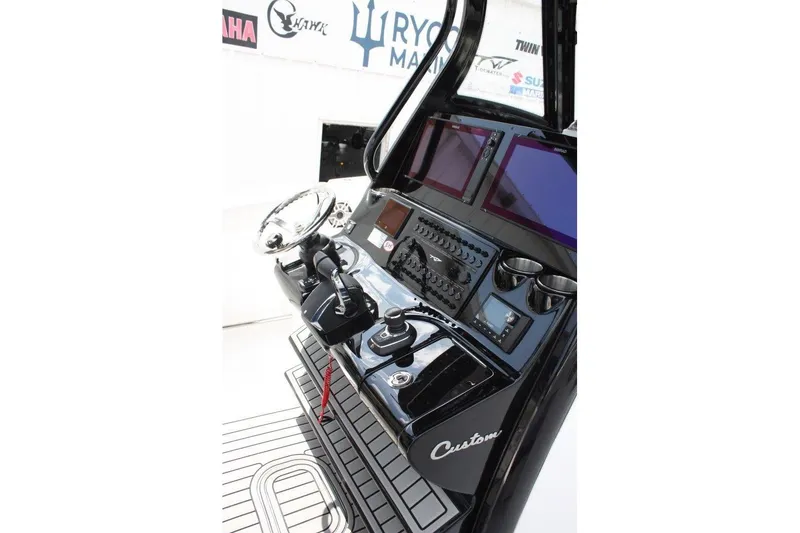 Slide: The Image of 2025 Tidewater 320 CC Adventure boat console with advanced controls and dual screens. - 28
