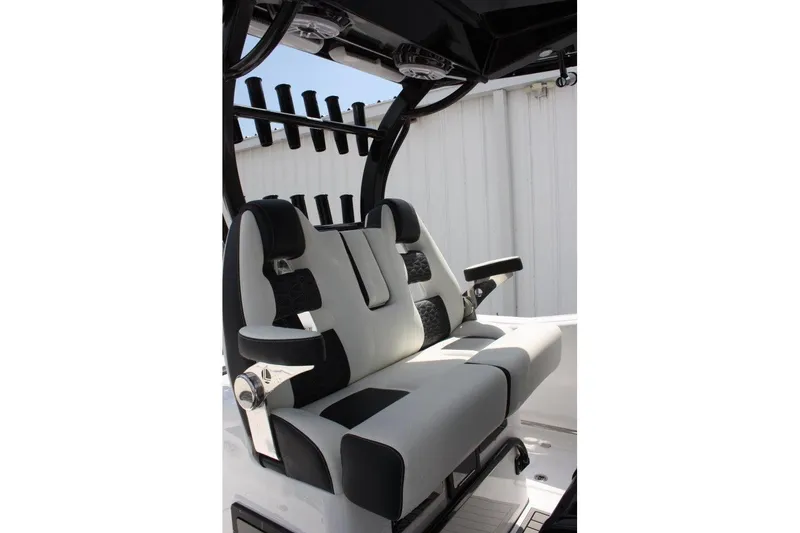 Slide: The Image of 2025 Tidewater 320 CC Adventure boat seating with black and white upholstery. - 30