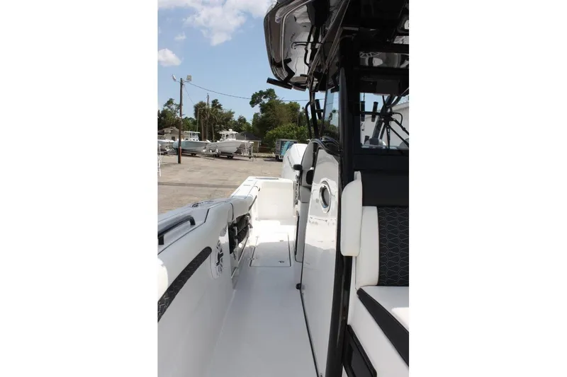 Slide: The Image of 2025 Tidewater 320 CC Adventure boat interior, showcasing sleek design and modern features. - 39