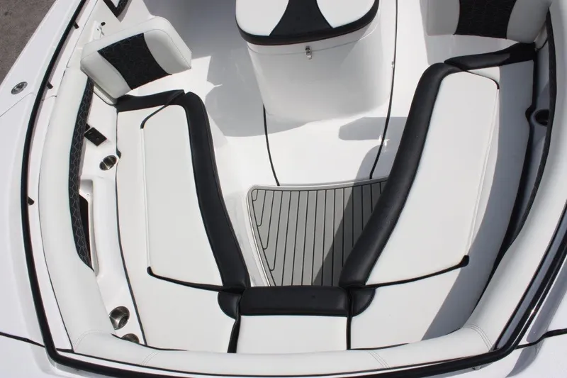 Slide: The Image of 2025 Tidewater 320 CC Adventure boat interior with white and black seating. - 41