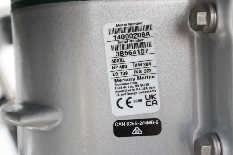 Slide: The Image of Mercury Marine engine label on 2025 Tidewater 320 CC Adventure boat, displaying model and serial numbers. - 65