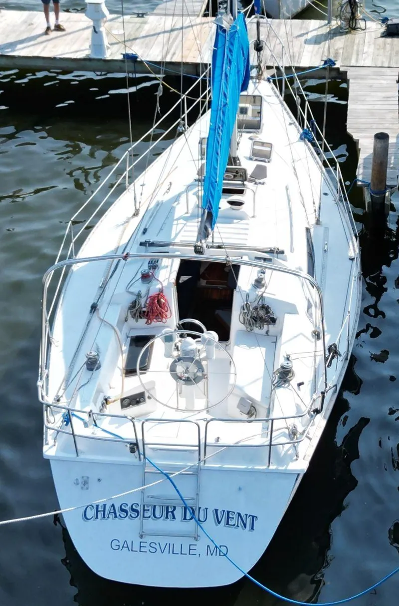 Slide: The Image of 1987 Hunter 34 sailboat docked, named "Chasseur du Vent," Galesville, MD. - 11