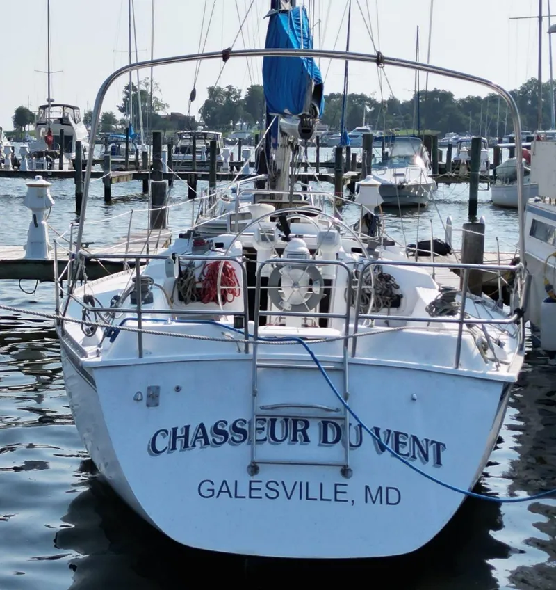 Slide: The Image of 1987 Hunter 34 sailboat "Chasseur du Vent" docked in Galesville, MD marina. - 4