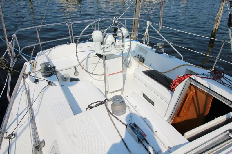 Slide: The Image of Cockpit of a 1987 Hunter 34 sailboat with steering wheel and ropes. - 5