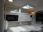 Slide: The Image of Interior of 2000 Sea Ray 310 Sundancer yacht with modern kitchen amenities. - 19