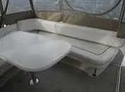 Slide: The Image of 2000 Sea Ray 310 Sundancer interior with seating and table. - 20