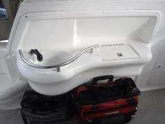 Slide: The Image of Sea Ray 310 Sundancer 2000 boat sink with storage bags underneath. - 21