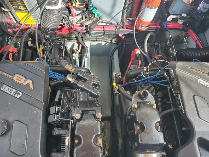 Slide: The Image of Engine compartment of a 2000 Sea Ray 310 Sundancer boat with V8 engines. - 24