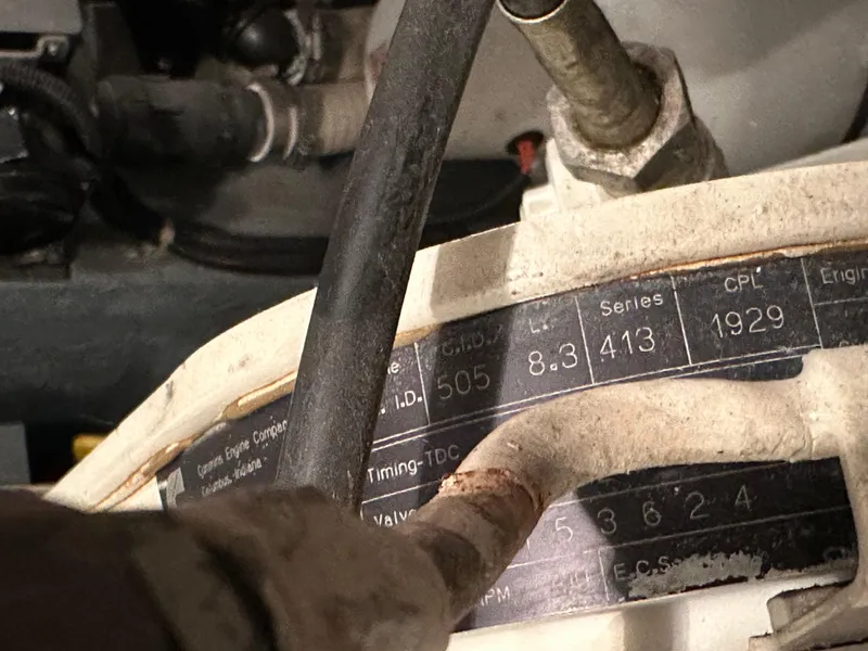 Slide: The Image of 1995 Carver 440 Aft Cabin Motor Yacht kitchen with microwave, stove, and dining area. - 25