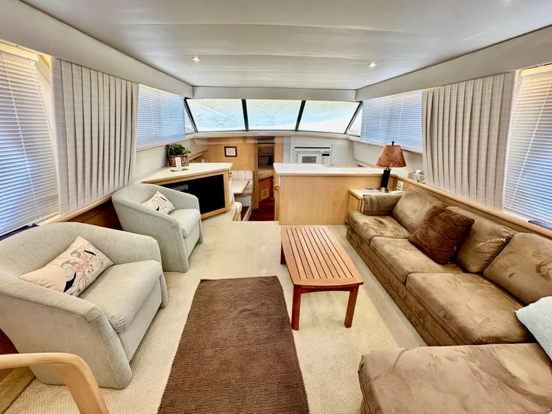 Slide: The Image of 1995 Carver 440 Aft Cabin Motor Yacht bathroom with shower, sink, and toilet. - 28