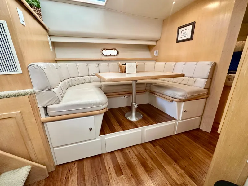 Slide: The Image of Interior of 1995 Carver 440 Aft Cabin Motor Yacht, featuring cozy bedroom with wood cabinetry. - 34