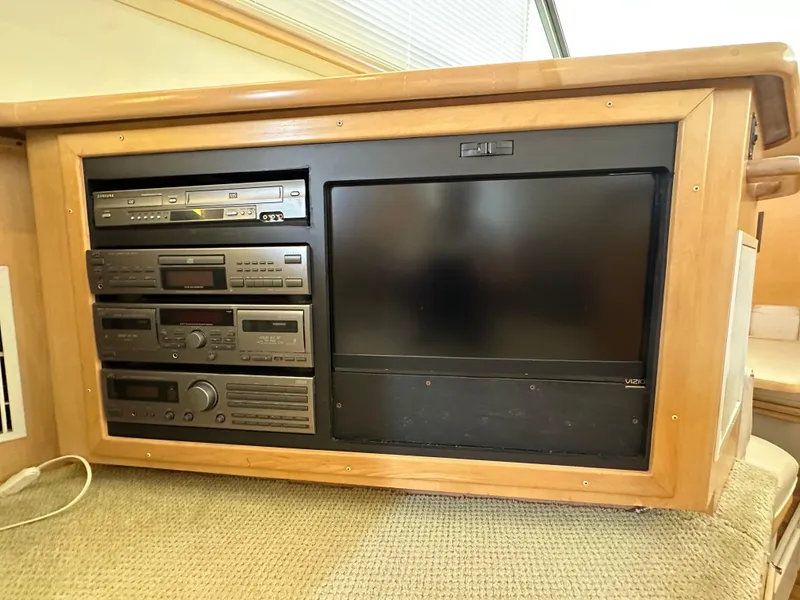 Slide: The Image of Engine room of 1995 Carver 440 Aft Cabin Motor Yacht, showing mechanical components and piping. - 43