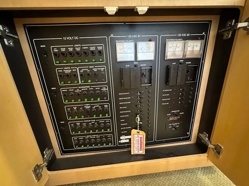 Slide: The Image of Engine room of 1995 Carver 440 Aft Cabin Motor Yacht with control panel. - 44