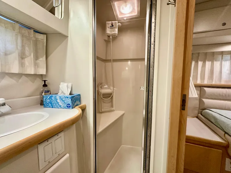 Slide: The Image of Engine room of 1995 Carver 440 Aft Cabin Motor Yacht, showcasing mechanical components. - 50