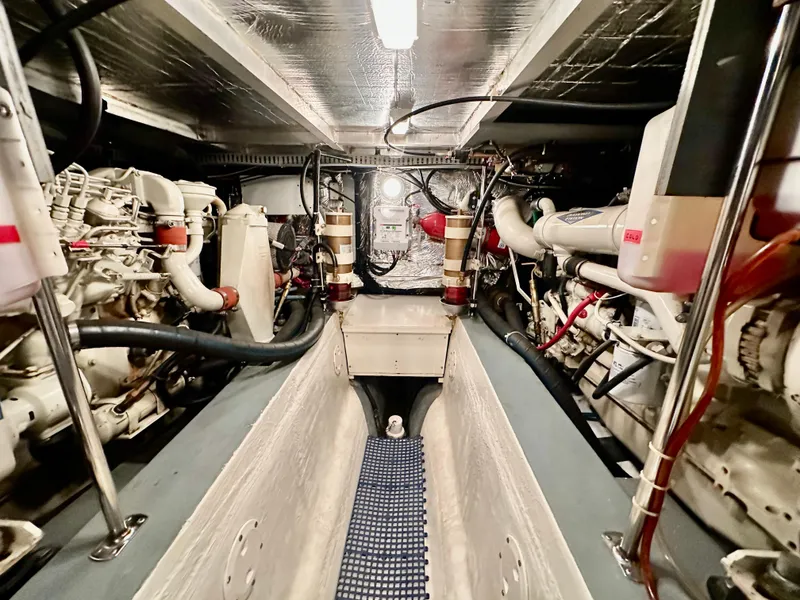 Slide: The Image of 1995 Carver 440 Aft Cabin Motor Yacht interior with cozy seating and wooden table. - 19