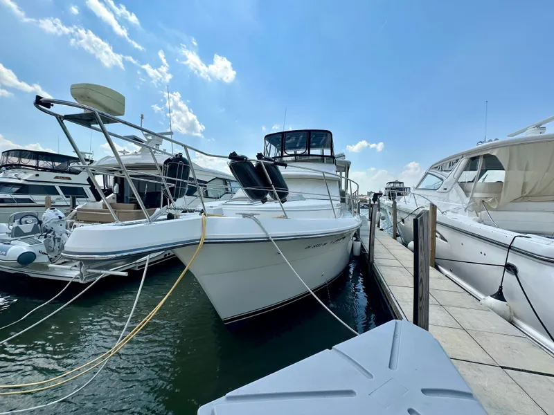 Slide: The Image of Luxurious interior of 1995 Carver 440 Aft Cabin Motor Yacht with cozy seating and elegant decor. - 2